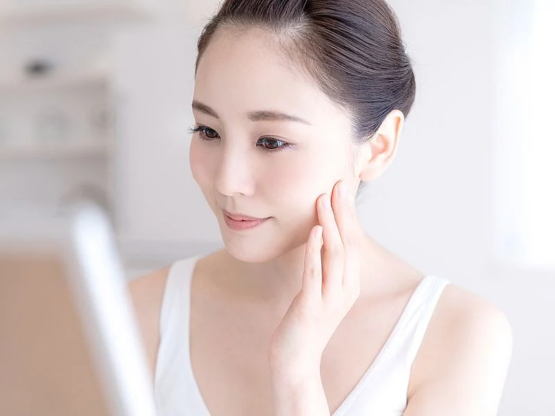 Person looking at their skin