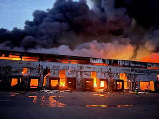 A warehouse storing frozen products is seen on fire after Russian shelling, in the village of Kvitneve in Kyiv region. File photo