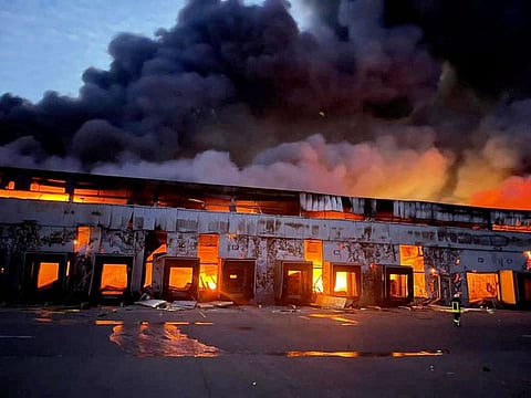 A warehouse storing frozen products is seen on fire after Russian shelling, in the village of Kvitneve in Kyiv region. File photo
