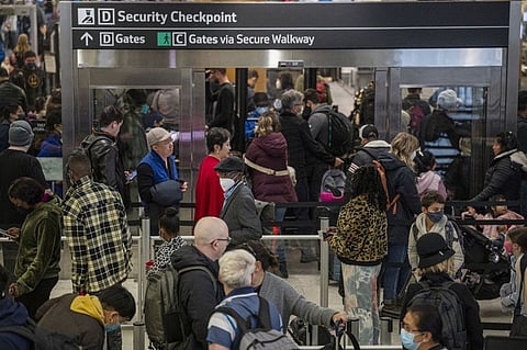Travellers wait through security at San Francisco International Airport (SFO) in San Francisco, California, US.