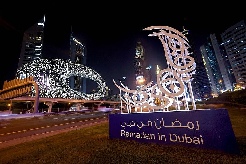 A traditional crescent moon decorates a street in front of the Future Museum in Dubai on April 2, 2022, during the first day of the Muslim holy fasting month of Ramadan.