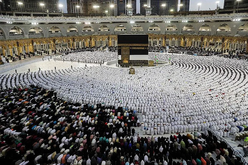 Worshippers and pilgrims (white) pray around the Kaaba, Islam's holiest shrine, at the Grand Mosque in Mecca. In addition to the Wi-Fi rollout, the Communications, Space and Technology Commission (CST) has implemented 100 per cent 4G and 5G network coverage across Mecca, Medina, and the holy sites of Mina, Arafat, and Muzdalifah.