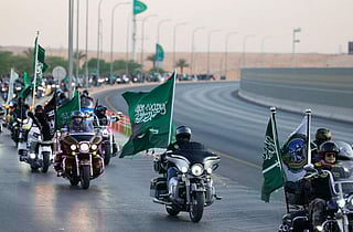Citizens and residents will celebrate over the coming week with events paying homage to the Kingdom’s heritage, art and culture. Above, Saudi and expat bikers wave national flags as they ride their motorcycles around the capital Riyadh during a parade to mark the Saudi national day.