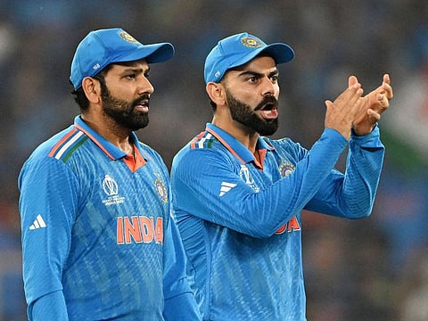 India’s captain Rohit Sharma (left) and teammate Virat Kohli in action during the ODI World Cup final against Australia in Ahmedabad on November 19, 2023.
