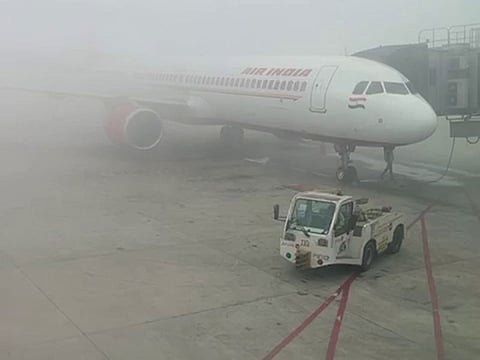 A dense blanket of fog enveloped Indira Gandhi International Airport in New Delhi. Several flights were delayed at Delhi airport due to low visibility.