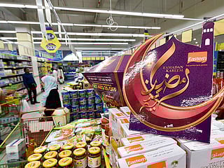 Shoppers browse Ramadan essentials at a UAE supermarket as retailers roll out price freezes and discounts ahead of the holy month.