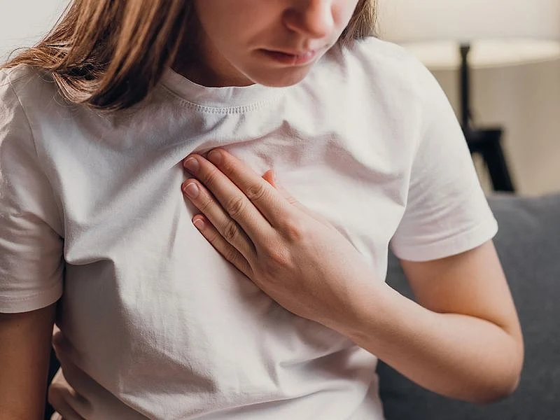 Person suffering heartburn