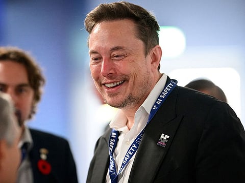Tesla, X (formerly known as Twitter) and SpaceX's CEO Elon Musk speaks with other delegates on Day 1 of the AI Safety Summit at Bletchley Park in Bletchley, Britain on November 1, 2023.