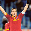 AS Roma's Francesco Totti celebrates after scoring against Fiorentina during their Italian Serie A soccer match at the Olympic stadium in Rome December 8, 2012.  