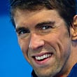 (FILES) A file photo taken on August 24, 2017 shows Michael Phelps of the US reacting during the medal ceremony following the men's 100m butterfly final at the Gold Coast Aquatic Centre in Gold Coast. Michael Phelps, the most decorated Olympian of all time, was on June 5, 2017, appointed to the board of an Australian company that deals with mental health issues, a subject close to his heart.  The American, who won 28 Olympic medals, is working to establish himself in business after quitting swimming last year and said joining Medibio met his aim to raise awareness of depression and similar problems.
 - MAGE RESTRICTED TO EDITORIAL USE - NO COMMERCIAL USE
 / AFP / PATRICK HAMILTON / MAGE RESTRICTED TO EDITORIAL USE - NO COMMERCIAL USE