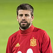 Spain's Gerard Pique (centre) attends with team mates a training session