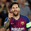 Lionel Messi celebrates scoring their fourth goal to complete his hat-trick against PSV Eindhoven in the Champions League match in Camp Nou, Barcelona, on September 18, 2018.  