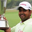 Indian golfer Anirban Lahiri poses with the trophy after winning
the Indian Open golf tournament in New Delhi yesterday.