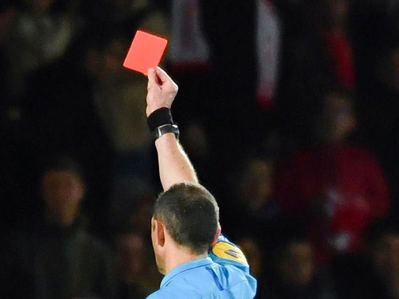 Referee shows the red card