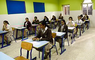 Grade 12 students settle down just before their CBSE Accountancy exam.
