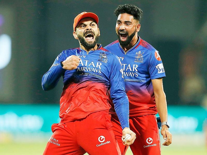 Royal Challengers Bengaluru's Virat Kohli and Mohammed Siraj celebrate