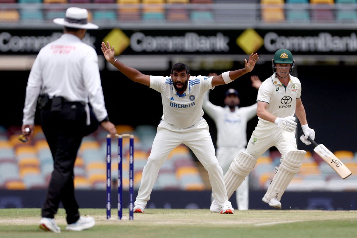 Indias Jasprit Bumrah (C) appeals unsuccessfully for LBW for Australias Nathan McSweeney (R) on day five of the third cricket Test match between Australia and India at The Gabba in Brisbane on December 18, 2024.