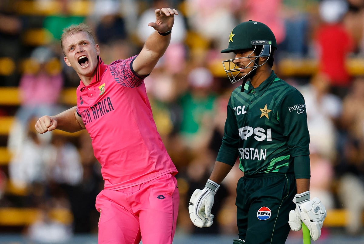 South Africa's Corbin Bosch (left) celebrates after the dismissal of Pakistan's Saim Ayub (R) during the third ODI cricket match at The Wanderers Stadium in Johannesburg on December 22.