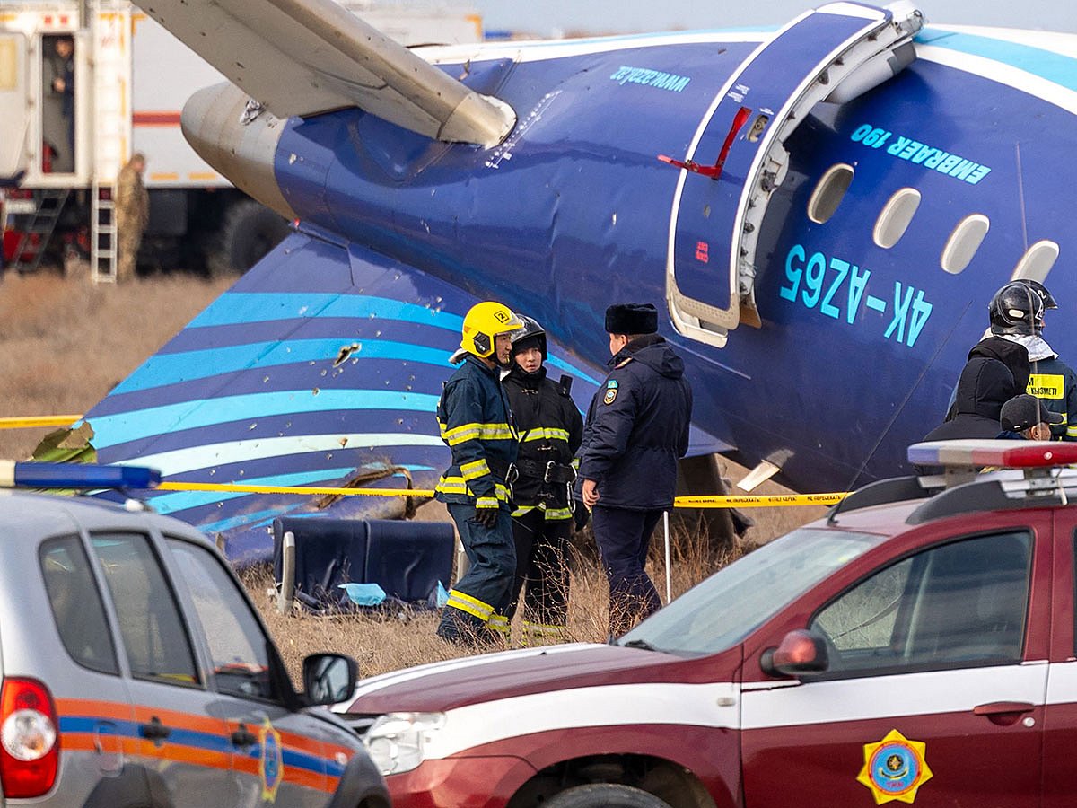 Emergency specialists work at the crash site of an Azerbaijan Airlines passenger jet near the western Kazakh city of Aktau on December 25, 2024.