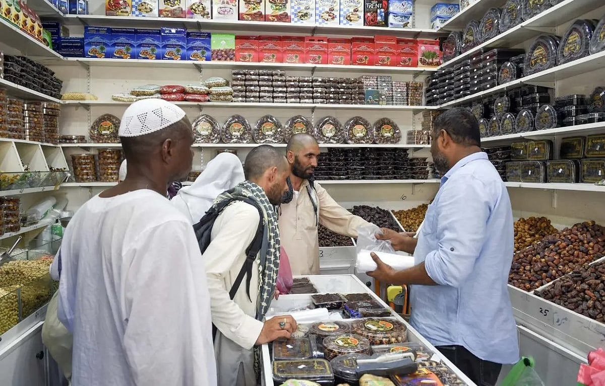Pilgrims shop for gifts at Medina stores before their departure from Saudi Arabia. 