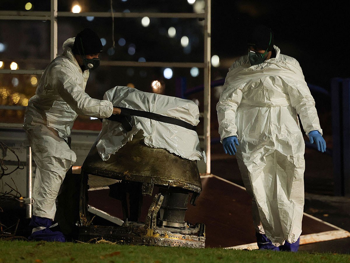 Israeli security forces inspect the fragments of a Houthi ballistic missile launched from Yemen in the central Israeli town of Bet Shemesh, near Jerusalem, on December 31, 2024.