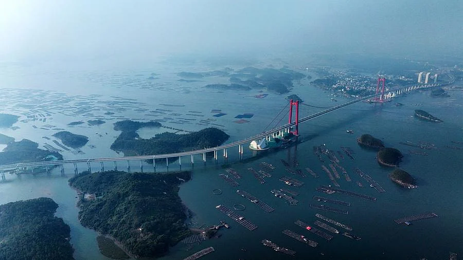 Captured by a drone on December 24, 2024, the Longmen Bridge in Qinzhou, Guangxi, stands tall and proud in south China, bridging more than just land — it’s connecting people, ports, and possibilities. 