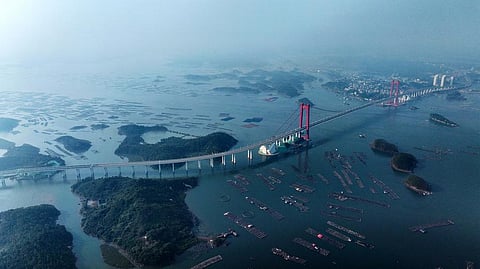 Captured by a drone on December 24, 2024, the Longmen Bridge in Qinzhou, Guangxi, stands tall and proud in south China, bridging more than just land — it’s connecting people, ports, and possibilities. 