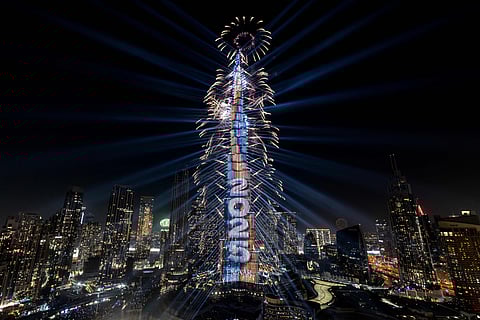 A light show and fireworks illuminate the Burj Khalifa, the world’s tallest building, during New Year's Eve celebrations in Dubai on January 1, 2025. 