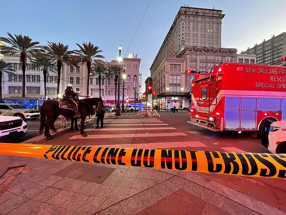 Police cordon off the intersection of Canal Street and Bourbon Street in the French Quarter of New Orleans, Louisiana.