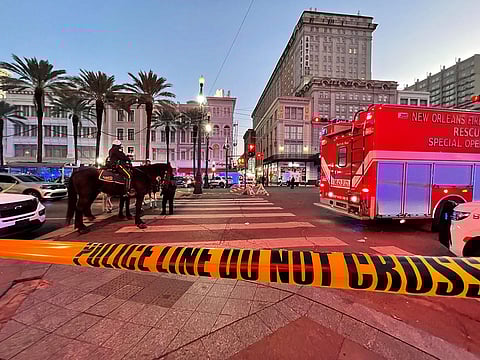 Police cordon off the intersection of Canal Street and Bourbon Street in the French Quarter of New Orleans, Louisiana.
