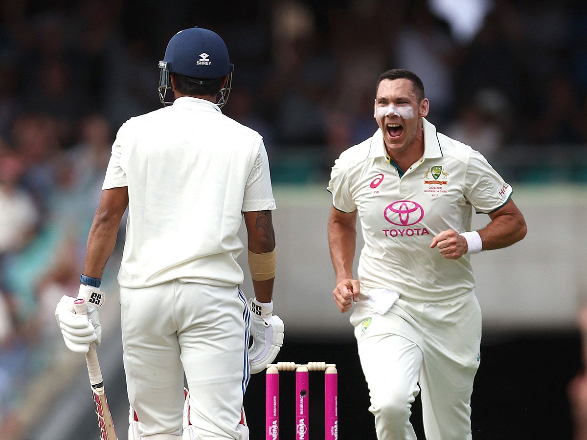 Australia’s Scott Boland (R) celebrates after dismissing India’s Nitish Kumar Reddy during day one of the fifth Test at the Sydney Cricket Ground on January 3, 2025. 