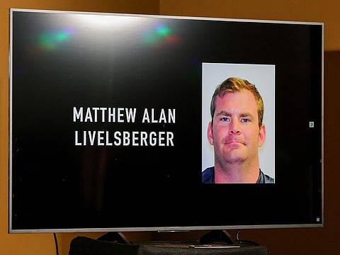 An image of Matthew Alan Livelsberger is displayed on a monitor during a news conference at Las Vegas Metropolitan Police Department headquarters about the Tesla Cybertruck that exploded on New Year's Day in front of the entrance to the Trump International Hotel & Tower Las Vegas on January 02, 2025 in Las Vegas, Nevada. 