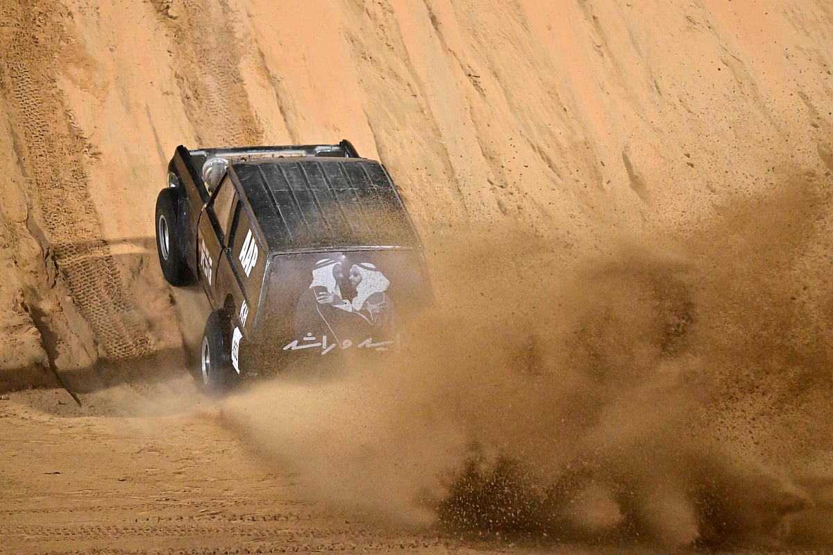 Competitors race their cars on the majestic Moreeb Dune in Liwa, known locally as Tal Moreeb. This breathtaking natural wonder, standing approximately 300 meters (984 feet) high, is one of the tallest dunes in the world, featuring a steep incline of nearly 50 degrees.