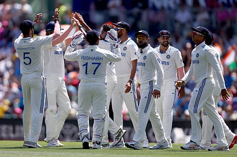 Indias Mohammed Siraj (C) reacts with teammates after dismissing Australias Travis Head during day two of the fifth cricket Test match at The SCG in Sydney on January 4.