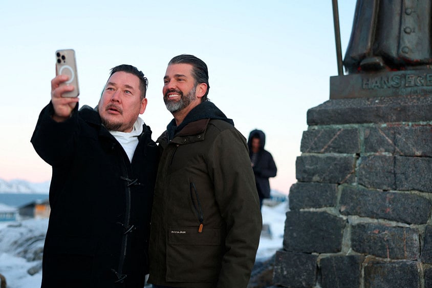 A well wisher takes a picture with US businessman Donald Trump Jr. after arriving in Nuuk, Greenland, on January 7, 2025 