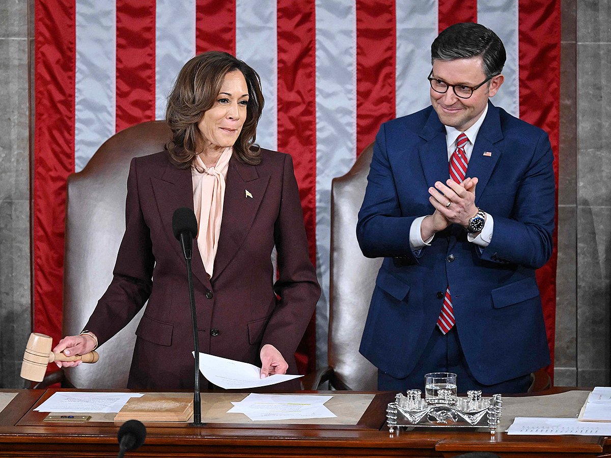 US Vice President Kamala Harris hits the gavel after reading the vote totals as Speaker of the House Mike Johnson looks on during of a joint session of Congress to certify the results of the 2024 Presidential election, inside the House Chamber at the US Capitol on January 6, 2025, in Washington, DC.   
