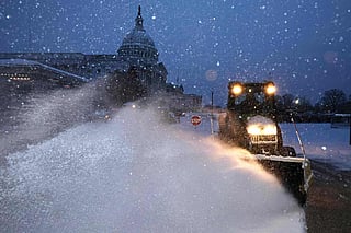 Winter storm leaves large US region blanketed in snow, ice