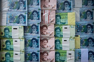 Iranian rial banknotes. Frozen overseas assets have become a key issue in negotiations between Tehran and Washington.