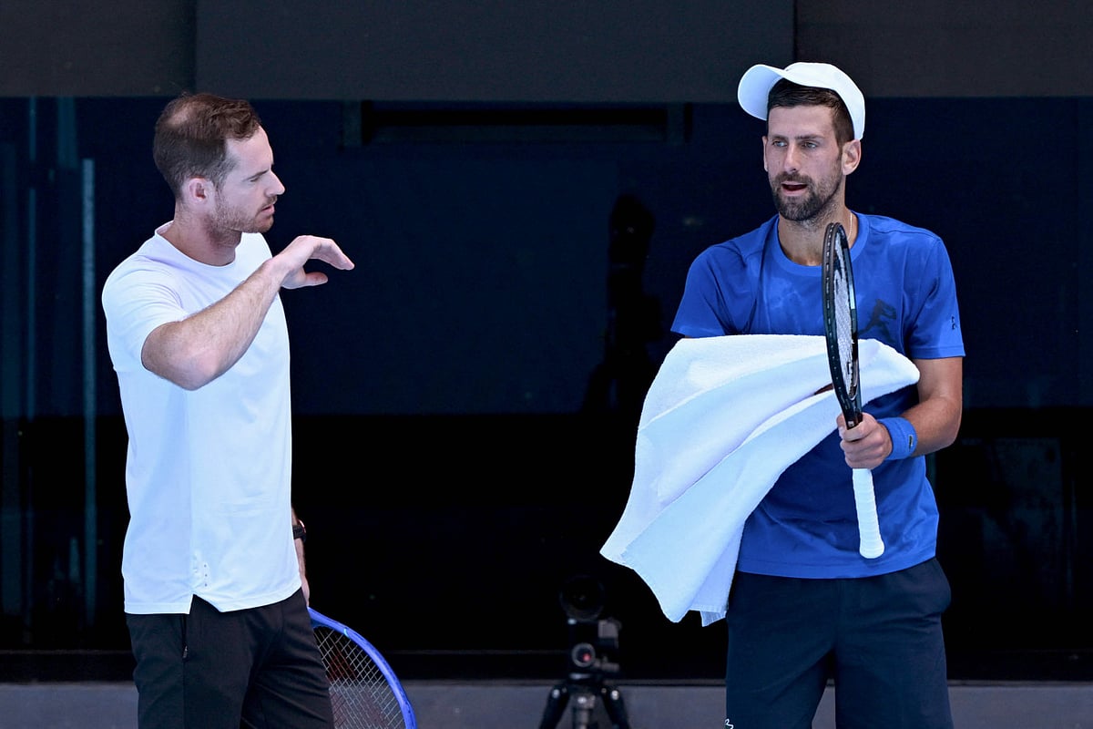 Serbia's Novak Djokovic (right) listens to coach Andy Murray during a training session ahead of the Australian Open tennis tournament in Melbourne on January 9.