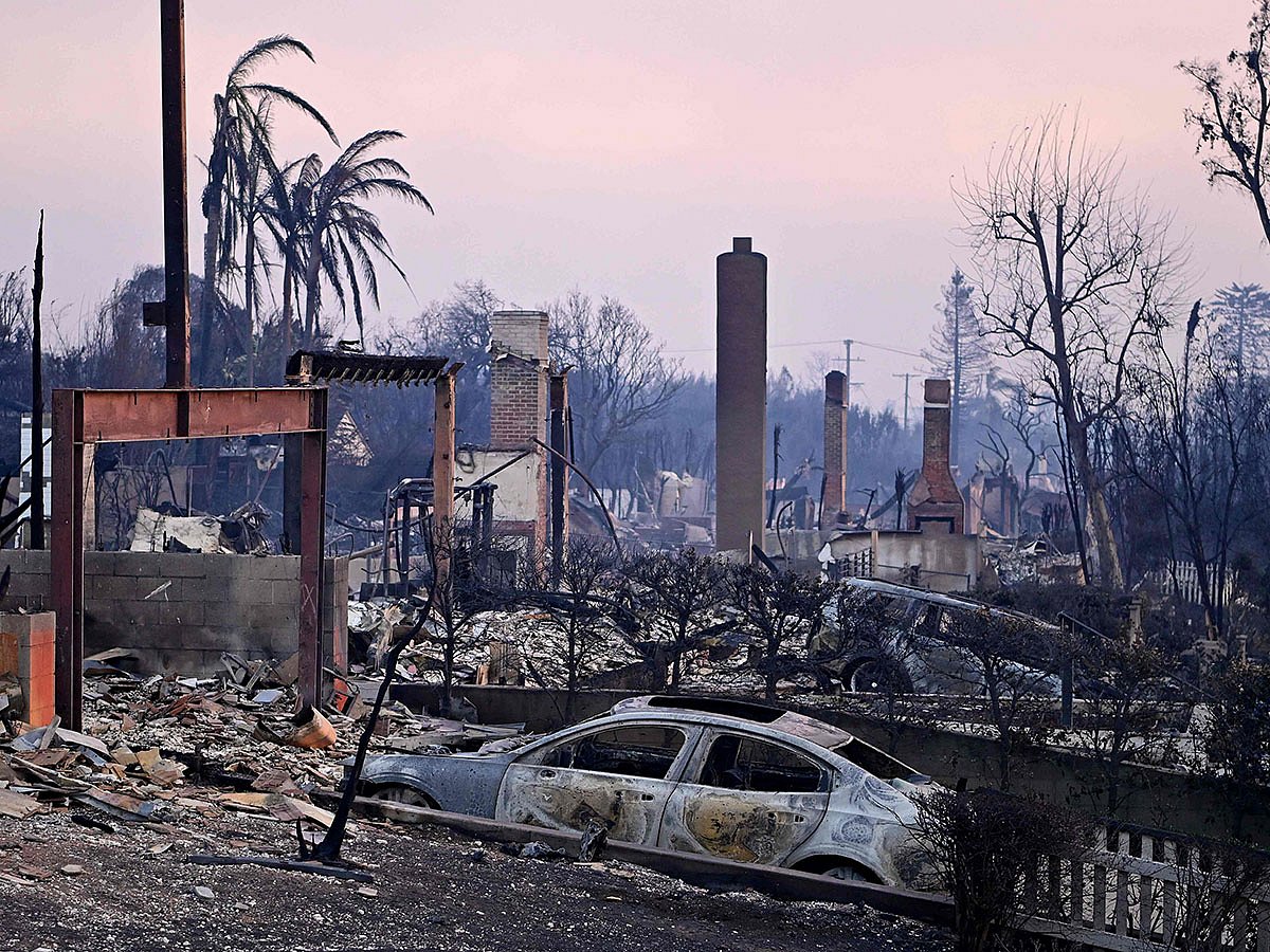Chimneys stand among the rubble after the passage of the Palisades Fire in Pacific Palisades, California.