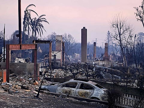 Chimneys stand among the rubble after the passage of the Palisades Fire in Pacific Palisades, California.