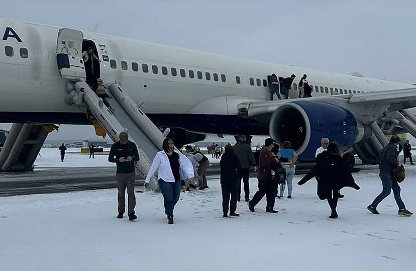 Passengers exit a Delta plane at Atlanta's Hartsfield-Jackson Airport after a runway emergency on January 10.
