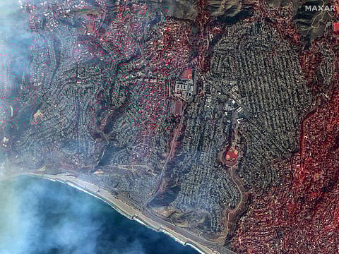 This handout satellite shortwave infrared (SWIR) picture courtesy of Maxar Technologies shows homes in Pacific Palisades, a neighborhood of Los Angeles, California on January 9, 2025, after the Palisades fire. 