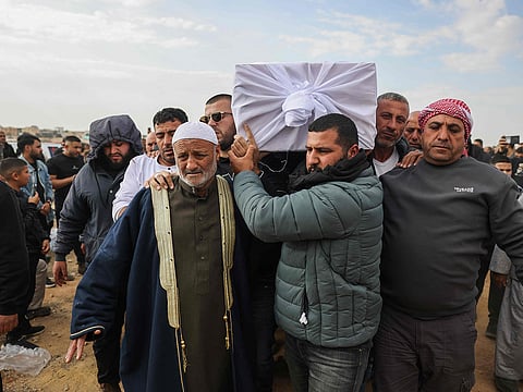 Relatives and friends of Israeli hostage Hamza Al Zayadna, 22, carry his coffin during his funeral in Israel's southern bedouin city of Rahat on January 10, 2025. 