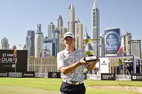 Louis Klein of Czechia with the Junior Dubai Desert Classic trophy at Emirates Golf Club.