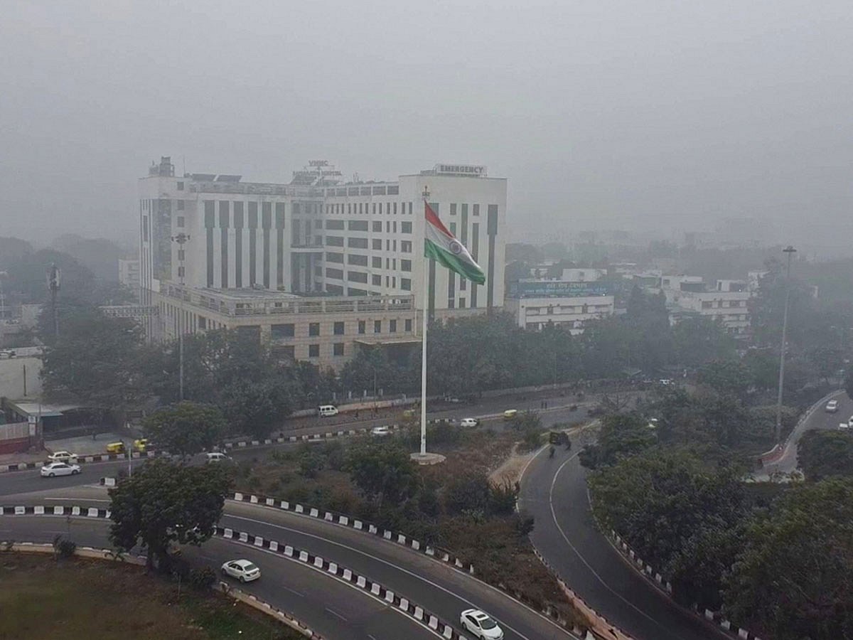 A thin layer of fog envelops the AIIMS area as the cold wave continues, in New Delhi.