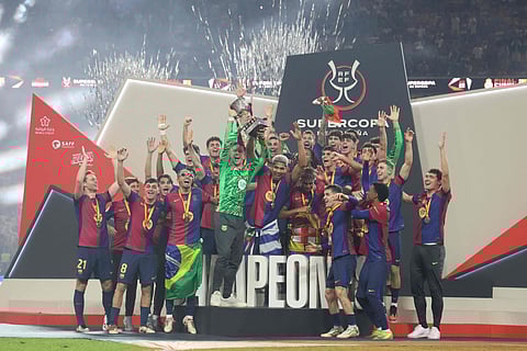 Barcelona celebrate their triumph in the Super Cup