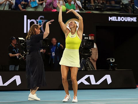 Belarus' Aryna Sabalenka (C) dances as she celebrates beating USA's Sloane Stephens in their women's singles match.