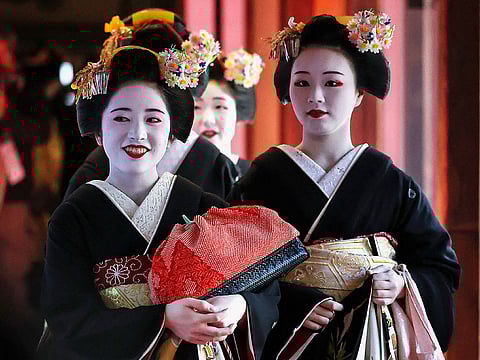 Kimono-clad geisha performers in Kyoto. For illustrative purposes only.
