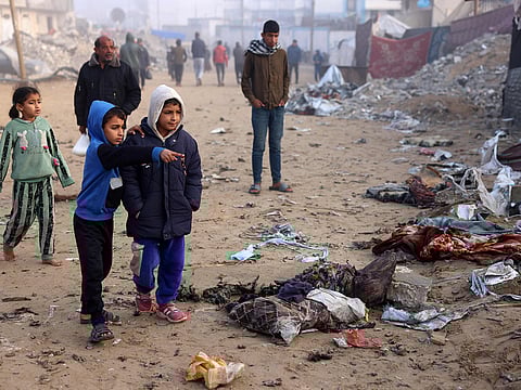 Palestinians check the remains of a tent that was hit by a reported overnight Israeli strike in the vicinity of Nasser hospital in Khan Yunis in the northern Gaza Strip on January 17, 2025. 